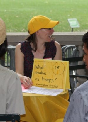 A volunteer for Conversations New York leads a discussion about happiness.