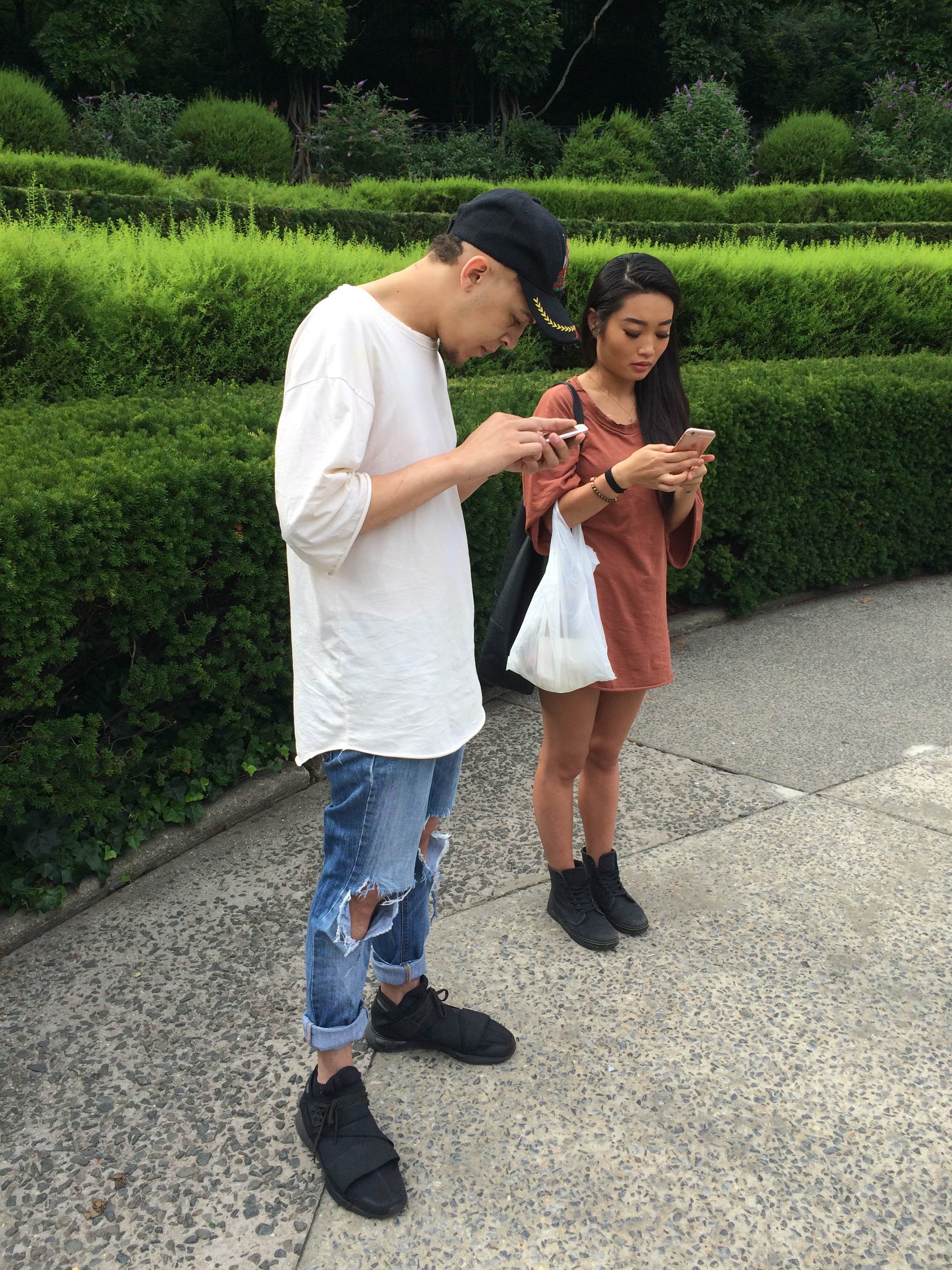 Team Mystic members Soyeon (20) and Frenlly (25) catch Pokemon at the Central Park Conservatory Garden last week. 