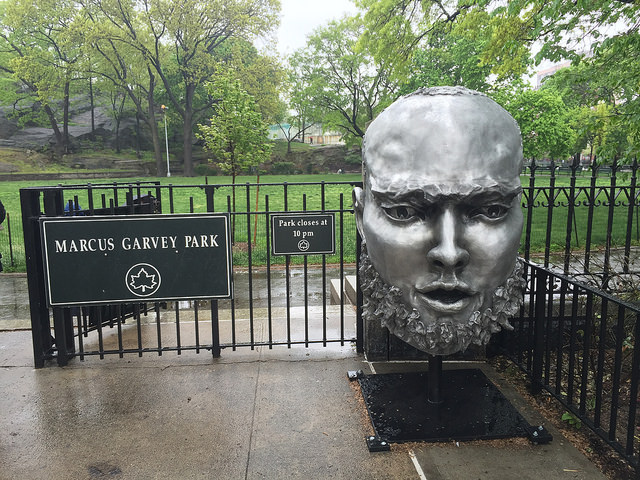 An art installation by Bob Clyatt is installed at one of the entrances to Marcus Garvey Park. Photo by Leann Garofolo